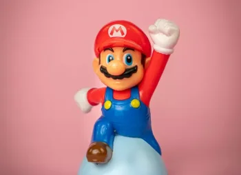 Mario figurine against pink background